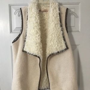 Cream vest with brown trim